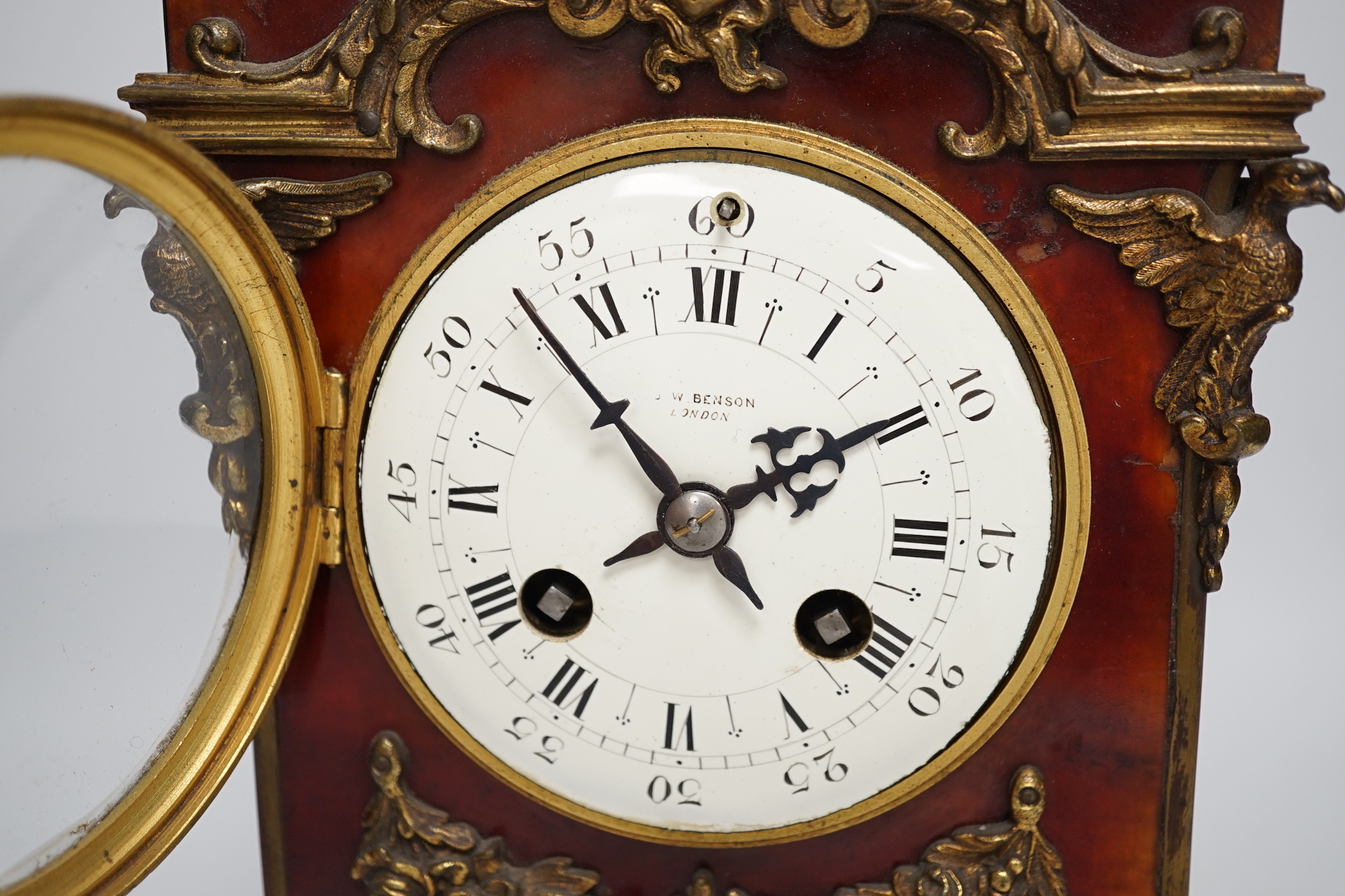 A late 19th century French tortoiseshell veneered mantel clock with cupid top, striking on a coiled gong, dial signed Benson, London, 39.5cm